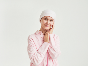 mature lady with scarf on head smiling